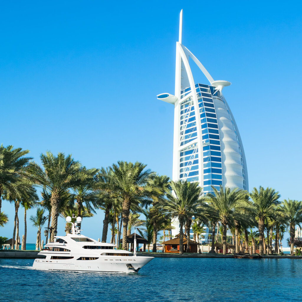 yacht in the ocean in front on burj al arab